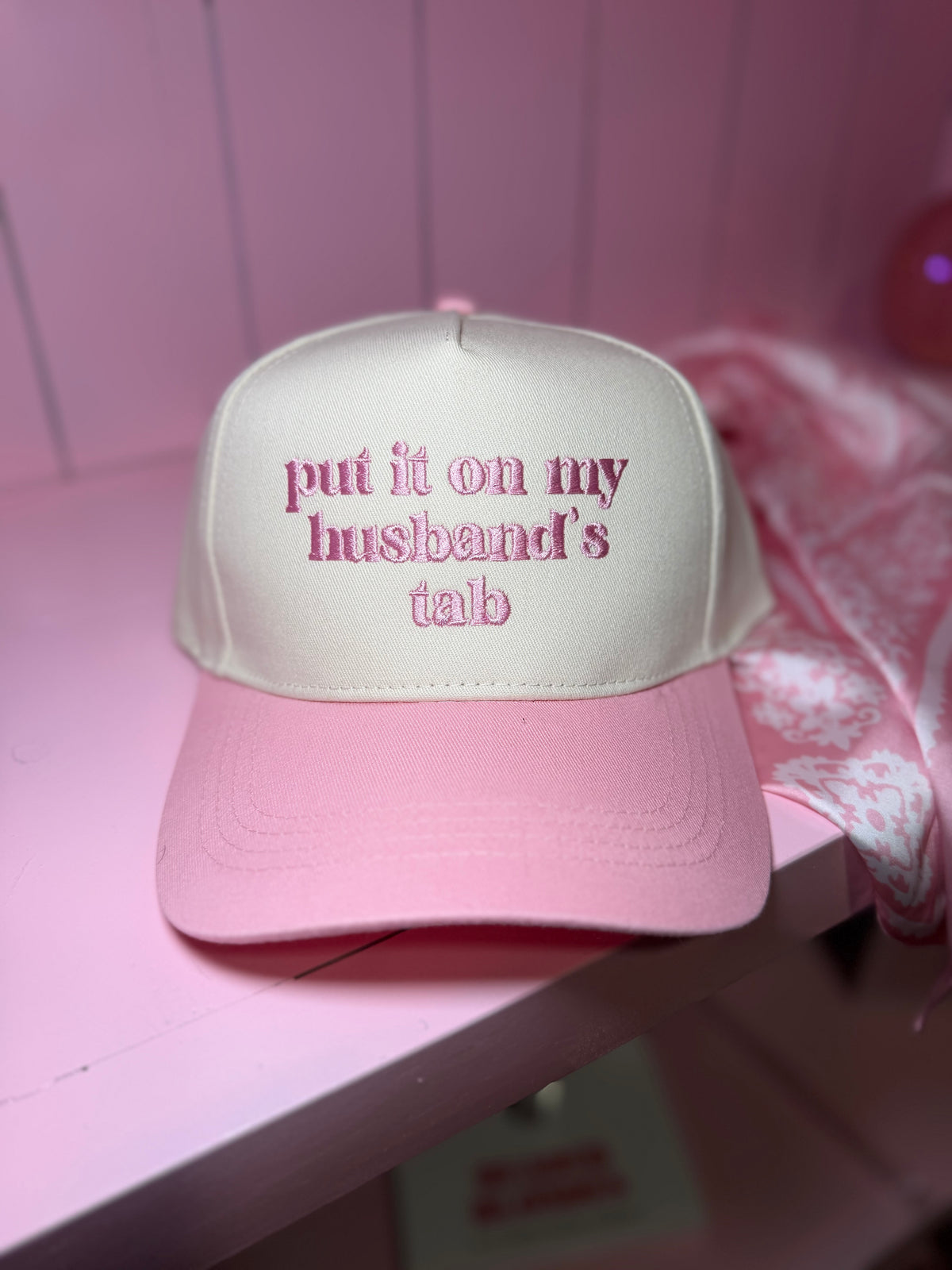 husbands tab trucker hat